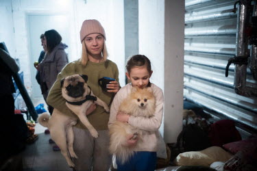 Anna and Alisha, new best friends, with their family pets. They nd their families have been sleeping in the basement of their building. The Retroville Mall next door was devastingly shelled last night...