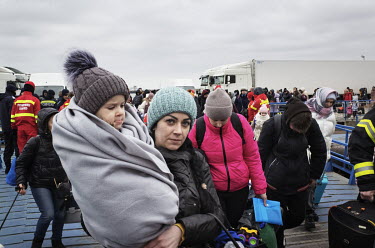 A mother and a child desembarking from a ferry bringing refugees from Ukraine.