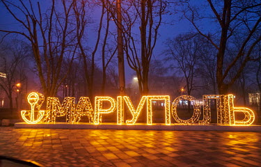 'Mariupol', spelled out in illuminated lettering, located next to the Donetsk Regional Theatre of Drama prior to the start of the Russian siege of the city.
