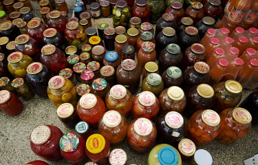 Pickled tomatoes, cucumbers, jams and compotes stored at the Circus building which has become a distribution centre for donations made by the people of Zaporizhia. Internally displaced persons, mostly...