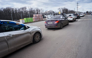 People in private cars many displaying signs reading 'Children' arrive to the relative safety of Zaporozhie after fleeing besieged Mariupol. They have to go through the Epicentr supermarket, where the...