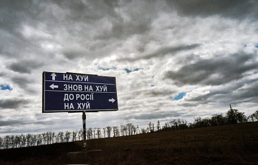 A billboard near Zaporizhia that reads: 'Fuck, Fuck Again, Go to Russia Fuck Yourself' (approximate translation).