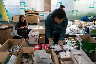 Volunteers organise first aid kits, medicines and pharmaceutical products donated for internally displaced people (IDPs) and communities affected by the Russian invasion of Ukraine. The items are sort...