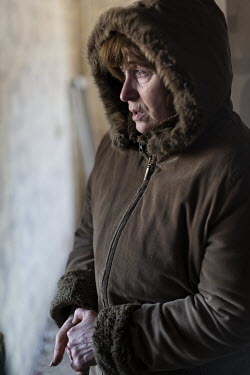 Lyudmila Lysenko looks over the wreckage of her apartment after it was shelled by Russian forces. Civilian, residential areas of western Kiev were targeted by Russian forces over several days in the t...