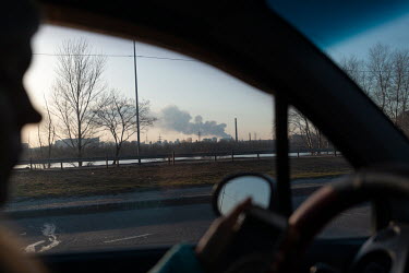 Smoke rises from the horizon in one of several civilian, residential areas of western Kiev that were targeted by Russian forces over several days in the third week of Russia's invasion of Ukraine.