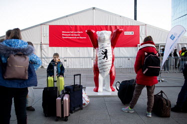 A Berlin mascot bear outside a welcome hall tent for Ukrainian refugees at the Hauptbahnhof, the railway station where trains arrive from Poland.