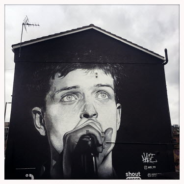 A mural of Ian Curtis (Joy Division) by street artist AKSE in the Northern Quarter.