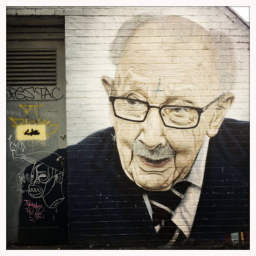 A mural in memory of Captain Sir Tom Moore by street artist AKSE in the Northern Quarter.