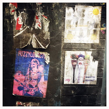 Street art posters on a wall in the Northern Quarter.