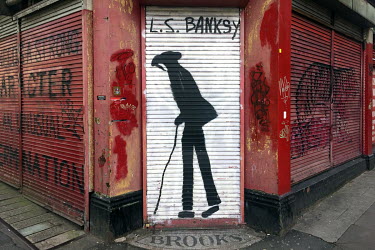 A grafitti mural in the style of Lowry called 'L.S. Banksy' in the Northern Quarter.