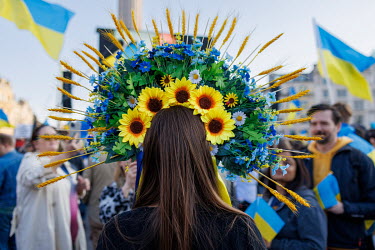 A woman wearing a traditional Ukrainian flower garland (vinok) during a protest against the Russian invasion of Ukraine in central London.