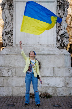 A woman waving an Ukrainian flag during a protest against the Russian invasion of Ukraine in central London.