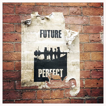 A street art poster 'Future Perfect' in the Northern Quarter.