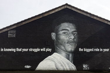 A mural portrait of Manchester United striker Marcus Rashford by AKSE in Withington.