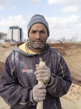 A worker at the People's Square construction site in Egypt's New Administrative Capital.  Following persistent problems of overpopulation, pollution and traffic congestion, the construction of a giant...