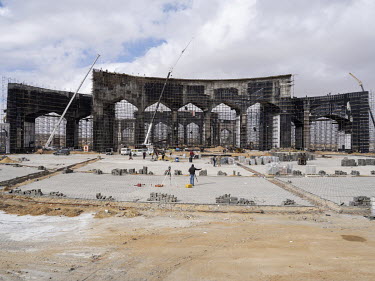 The construction site of one of the giant entrance gates to Egypt's New Administrative Capital. Following persistent problems of overpopulation, pollution and traffic congestion, the construction of...