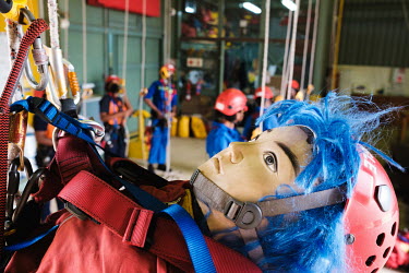 A mannequin, used in rescue drills, as potential invasive tree clearing team recruits attend a rope work operations, safety and rescue course at High Angle Training. To successfully complete the cours...