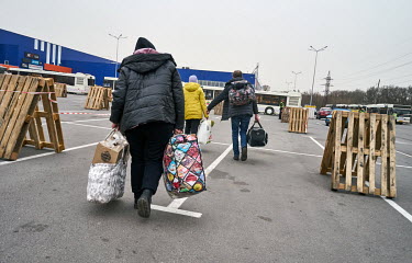 IDPs from Berdyansk carry all their belongings that they could pack during their evacuation. They arrived in Zaporozhia in one of two Ukrainian Red Cross evacuation buses. The rest of convoy of more t...
