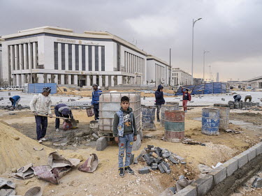 Workers in the construction site at the Government District in Egypt's New Administrative Capital. Following persistent problems of overpopulation, pollution and traffic congestion, the construction o...