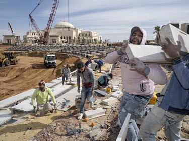 Workers labouring at the People's Square construction site, in front of the Presidential Palace in Egypt's New Administrative Capital. Following persistent problems of overpopulation, pollution and t...