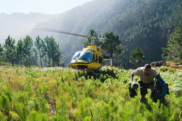 Richard Bugan, Monitoring and Evaluation Manager at The Nature Conservancy South Africa, being dropped off by a helicopter in a remote catchment area that feeds the Theewaterskloof dam. He is monitori...