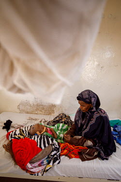 Magda Abdullahi Mohammed is watched over by her great-grandmother in Burao hospital where she is fighting for her life after being unconscious for four days. She has been in the hospital for ten days...