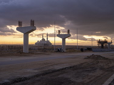 Dusk at a monorail construction site in Egypt's New Administrative Capital.Following persistent problems of overpopulation, pollution and traffic congestion, the construction of a giant new satellite...