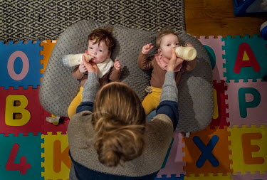Drifa Hrund Guomundsdottir feeding the twins Baldur Logi and Brynja Lill their first meal of the day in their home in Reykjavik.  A baby boom in Nordic nations comes as many other wealthy countries ar...