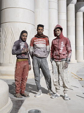 A group of young workers at the newly built Arc de Triomphe in Egypt's New Administrative Capital.   Following persistent problems of overpopulation, pollution and traffic congestion, the construction...