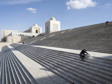 Workers fixing stairs at the newly built Misr Mosque in Egypt's New Administrative Capital.  Following persistent problems of overpopulation, pollution and traffic congestion, the construction of a gi...