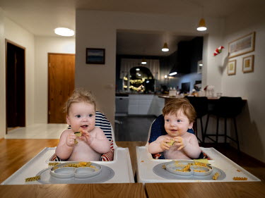 Twins Baldur Logi (R) and Brynja Lill eat pasta and cucumber, their last meal of the day, in their home in Reykjavik.  A baby boom in Nordic nations comes as many other wealthy countries are seeing de...
