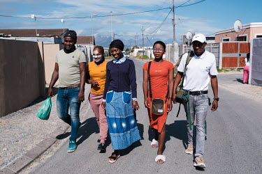 Zikhona Gcakamani (centre) with her husband Abongile Mfene (left), sister Olwethu Gcakamani (second left), friend Zanele Njilana (second right) and cousin Johannes Mkuseli near her home in Khayelitsha...