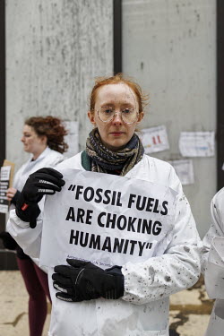 Scientists from Extinction Rebellion flypost Shell's London headquarters with scientific papers on climate change.