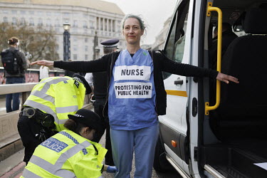 On day two of Extinction Rebellion's 'April Rebellion', XR rebels marched from Hyde Park to 'occupy' Lambeth Bridge where a group of doctors and nurses were searched and arrested by the police.