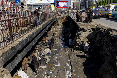 People gathered beneath a bridge in central Kabul where large numbers of drug users regularly congregate despite the authorities attempts to prevent it.