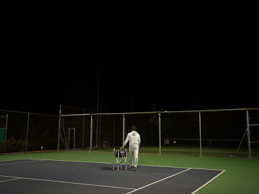 Juan Carlos Ferrero, a former professional tennis player and the coach of young prospect Carlos Alcaraz (out of shot), training together late in the evening at the Juan Carlos Ferrero Equelite Sport A...