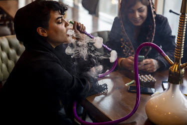 Young women smoking shisha pipes at the Prime restaurant.
