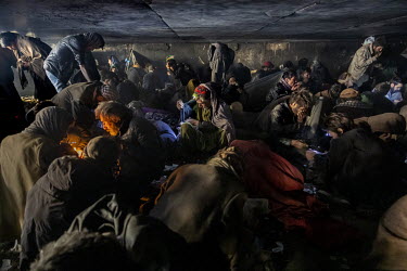 People gathered beneath the Kote Sangi bridge in central Kabul where large numbers of drug users regularly congregate despite the authorities attempts to prevent it.