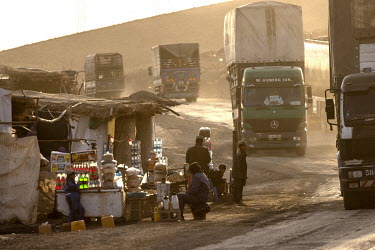 Stalls selling drinks and snacks to truck drivers on the A1 road between Ghazni and Kandahar.