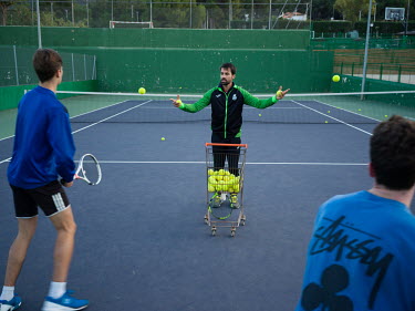 A trainer with two youths at the Real Tennis Club of Murcia where Carlos Alcaraz (who as of 4 April 2022 is ranked world number 11) started training.