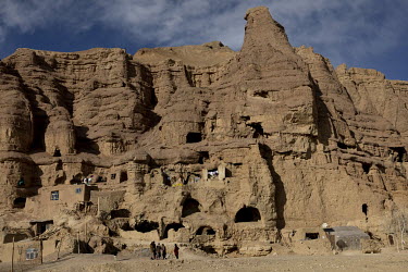 Cave dwellings in a cliff inhabited by Hazaras deported from Iran.