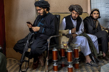 Armed men in the offices of the Taliban governor and vice-governor.