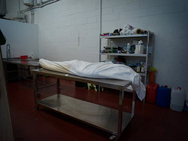 The body of a drowned migrant Martin Zamora's funeral home where he will carry out the embalming process. Martin Zamora has become known, in his corner of southern Spain, as 'the gravedigger of migran...