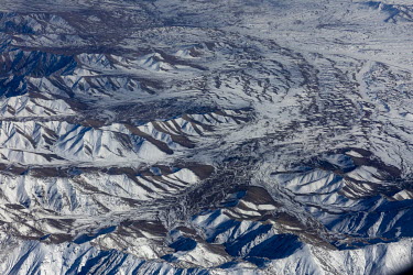 Snow covered mountains seen from the air.