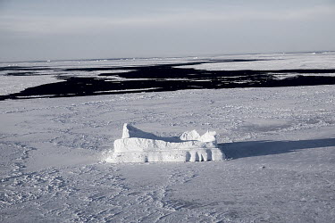 Huge cracks cleave the sea ice of Disko Bay into huge floating islands. Locals claim that this breaking up of the winter ice is a recent phenomenon which wasn't seen 20 years ago. It has also been sug...