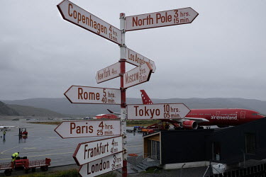 A sign points to various places around the world at Kangerlussuaq, Greenland's international airport which is sited in the interior of the west coast to minimise foggy weather.