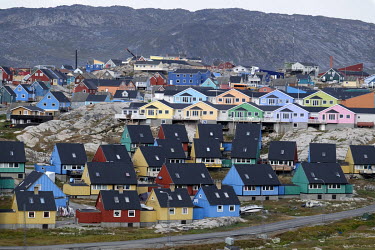 Brightly coloured houses in Ilulissat. The typical Greenland home is perfectly suited for winter with good insulation and steeply pitched roofs to allow snow to slide.
