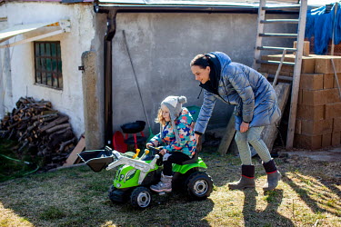 Maria Ustenko and her daughter Mila (3), who fled their home in Kharkiv after the Russian invasion, playing in the garden at the home of Ukrainian business woman ex-pat Liza Zinova where the mother an...