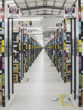 Colour-coded shelving extends almost as far as the eye can see inside Amazon's 'BHX1' fulfilment centre.