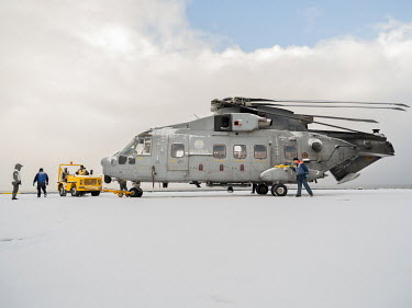 Italian Navy Aviation helicopter on a snow covered flight deck on the Italian aircraft carrier Giuseppe Garibaldi during 'Cold Response 2022' (CR 22), a Norwegian military exercise involving invited a...